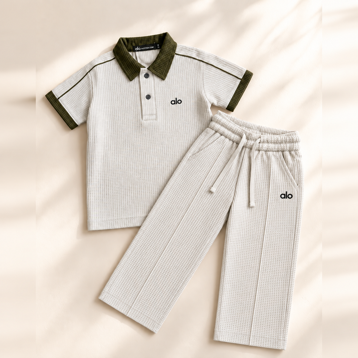 alo Polo Cord set — product flat lay with straight pleated trousers