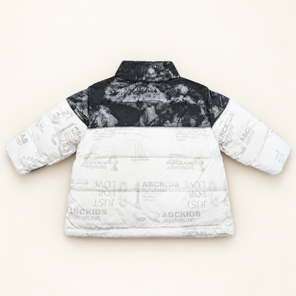 Back view of Monochrome Puffer Jacket with charcoal shoulder panel and white printed padded body