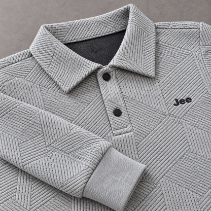 Close-up of raised geometric knit texture, two-button polo collar, Jee logo and ribbed sleeve cuff