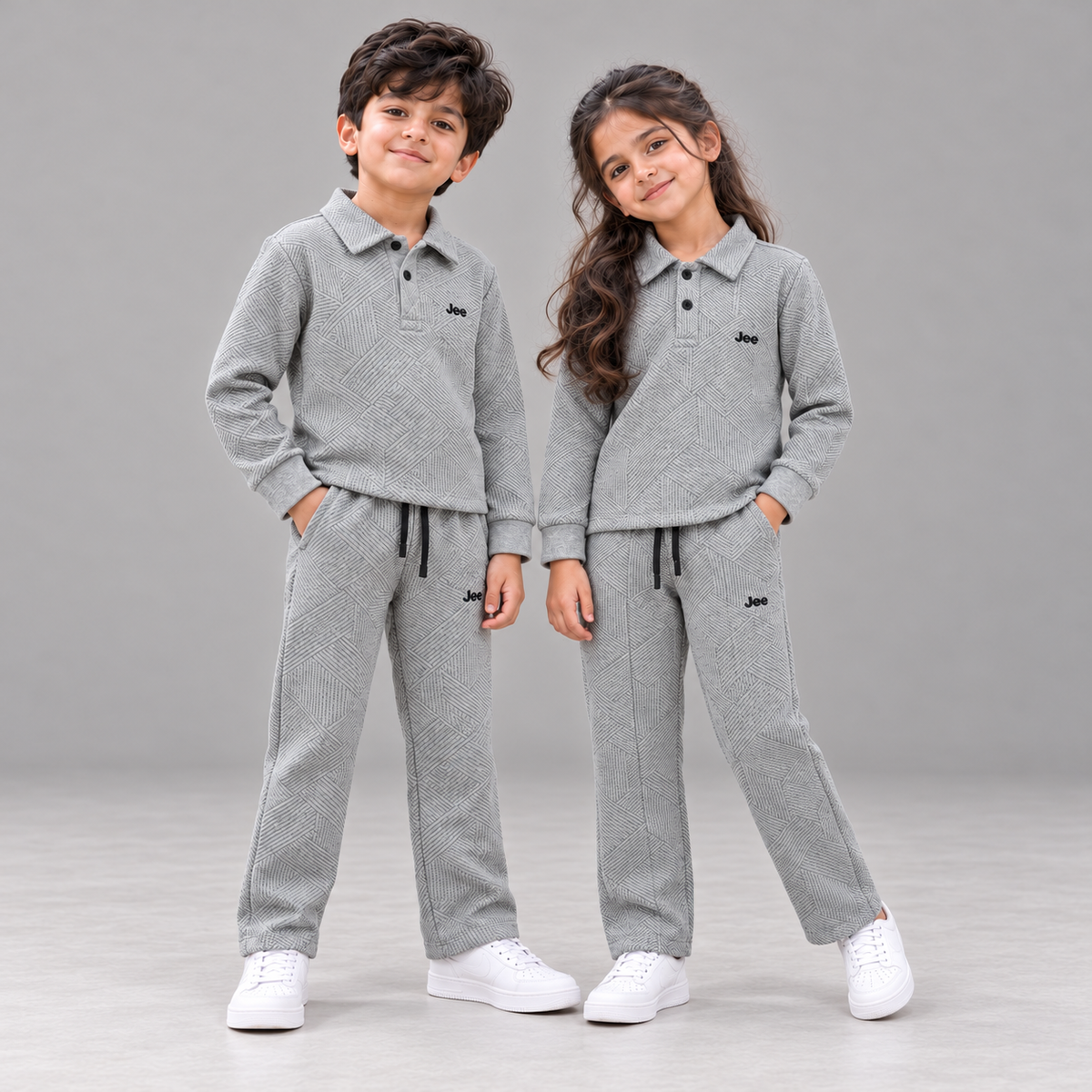 Boy and girl wearing Born78 Stone Grey Geometric Textured Polo Winter Co-ord Set