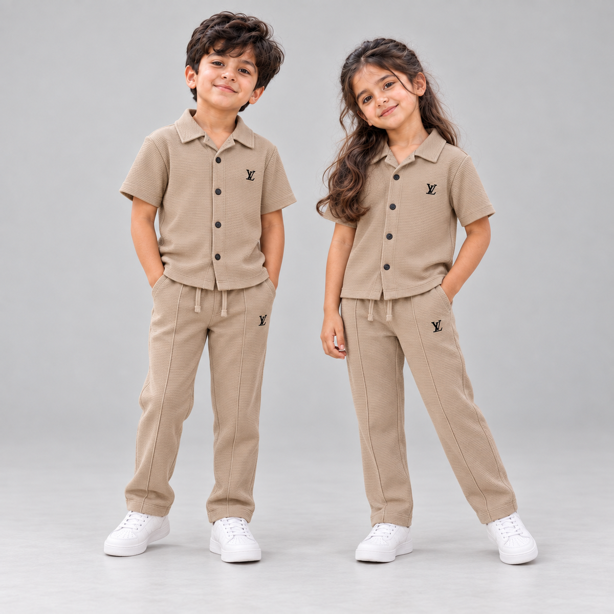 Born 78 LV button-down co-ord set in Beige, boy and girl in neutral studio