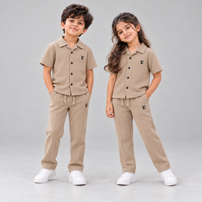Born 78 LV button-down co-ord set in Beige, boy and girl in neutral studio