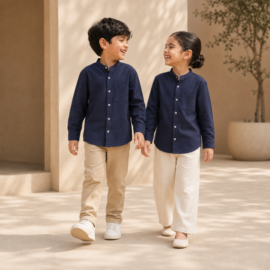 Boy and girl wearing navy cotton band-collar shirts