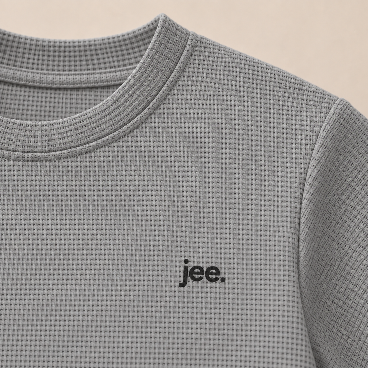 Premium fine-knit Gray shirt close-up with jee. logo