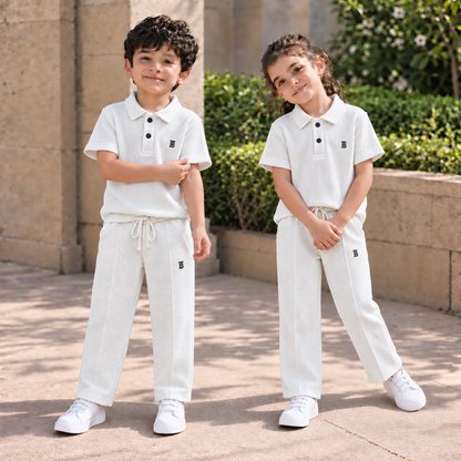 BORN 78 Waffle-Knit Polo Cord Set in white — natural boy and girl lifestyle image
