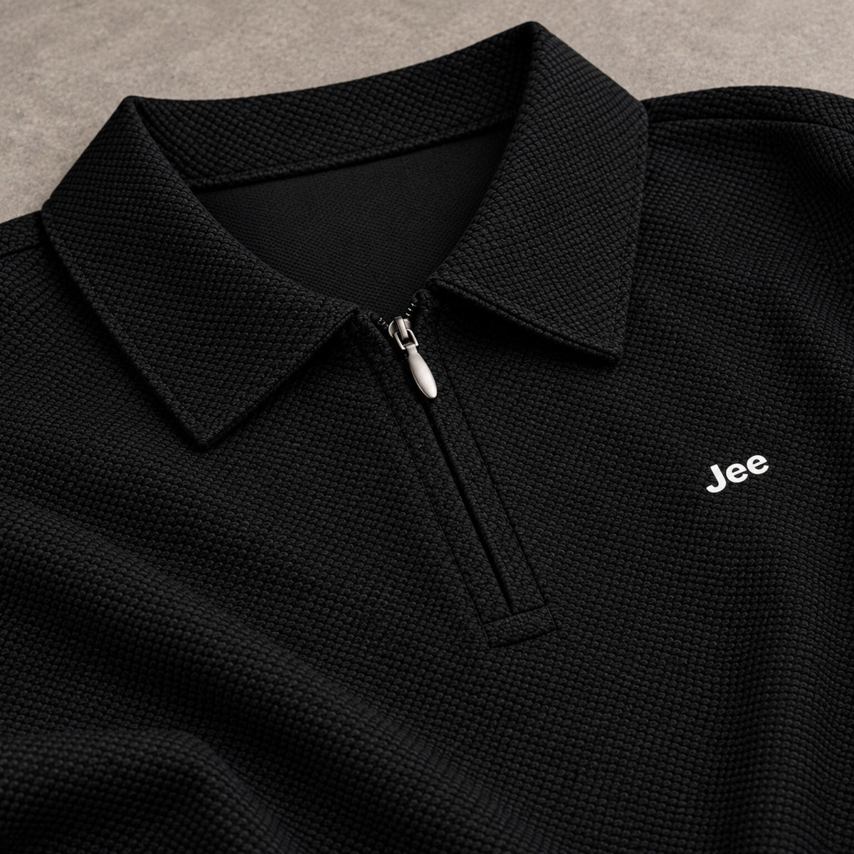 Close-up of the premium textured zip-neck fabric